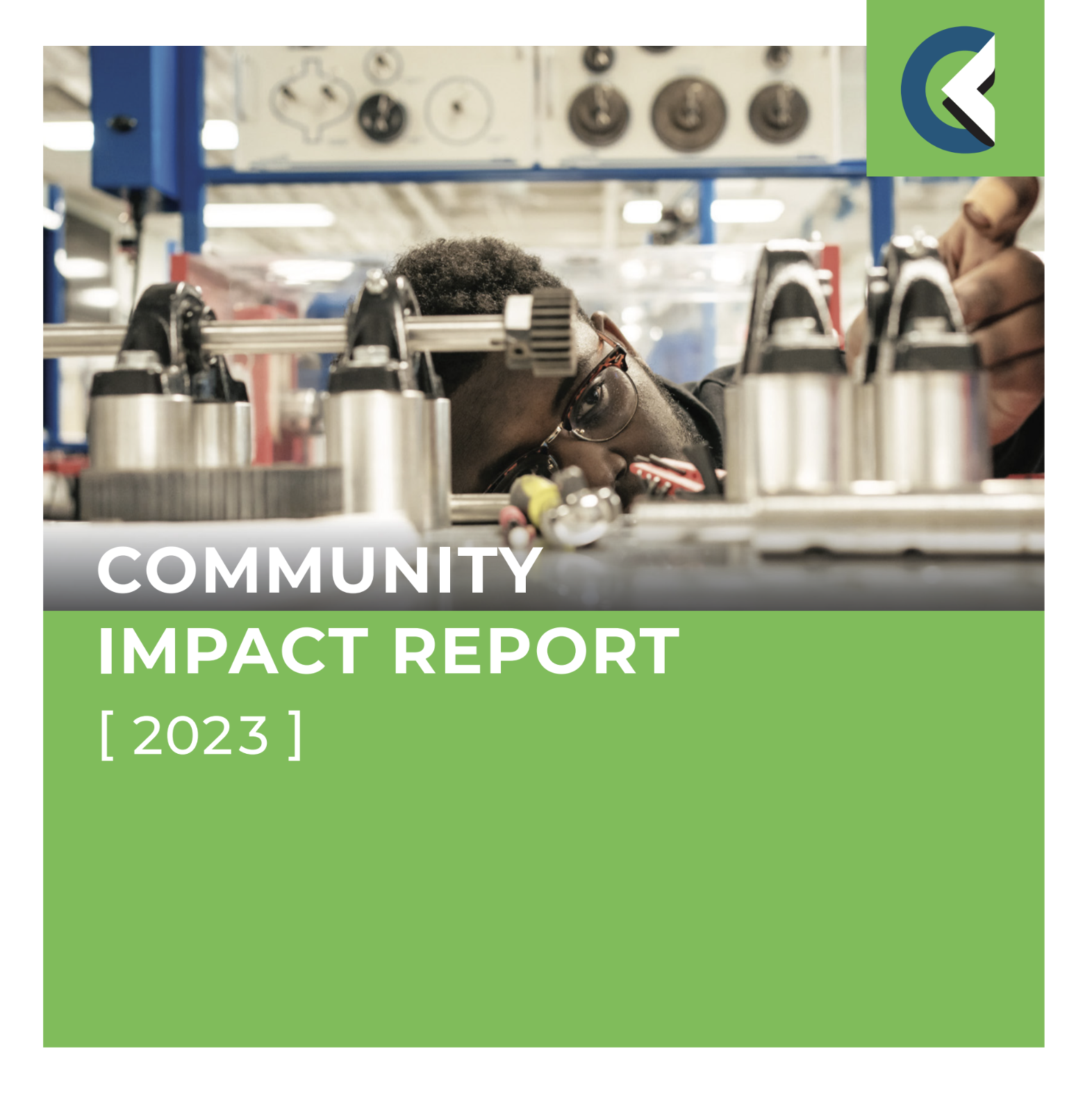 Cover of the 2023 Community Impact Report showing student looking at manufacturing equipment