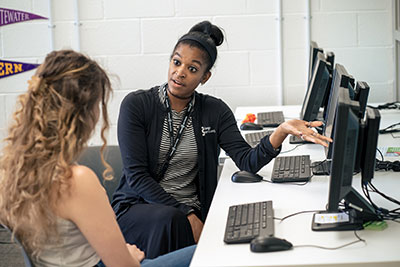 Student getting advising support from staff member