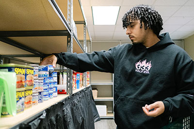 Student perusing food items in SHARE Market
