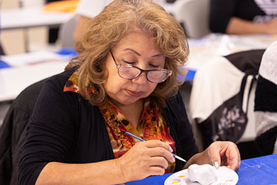 Adult student participating in art class