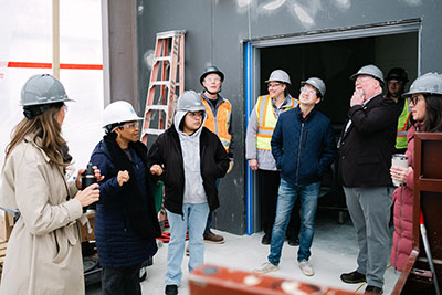 Community members touring the CLC Urban Farm Center during construction