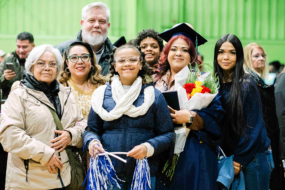A family posing after the fall graduation