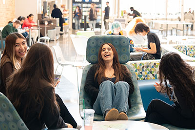 A group of students laughing in the common