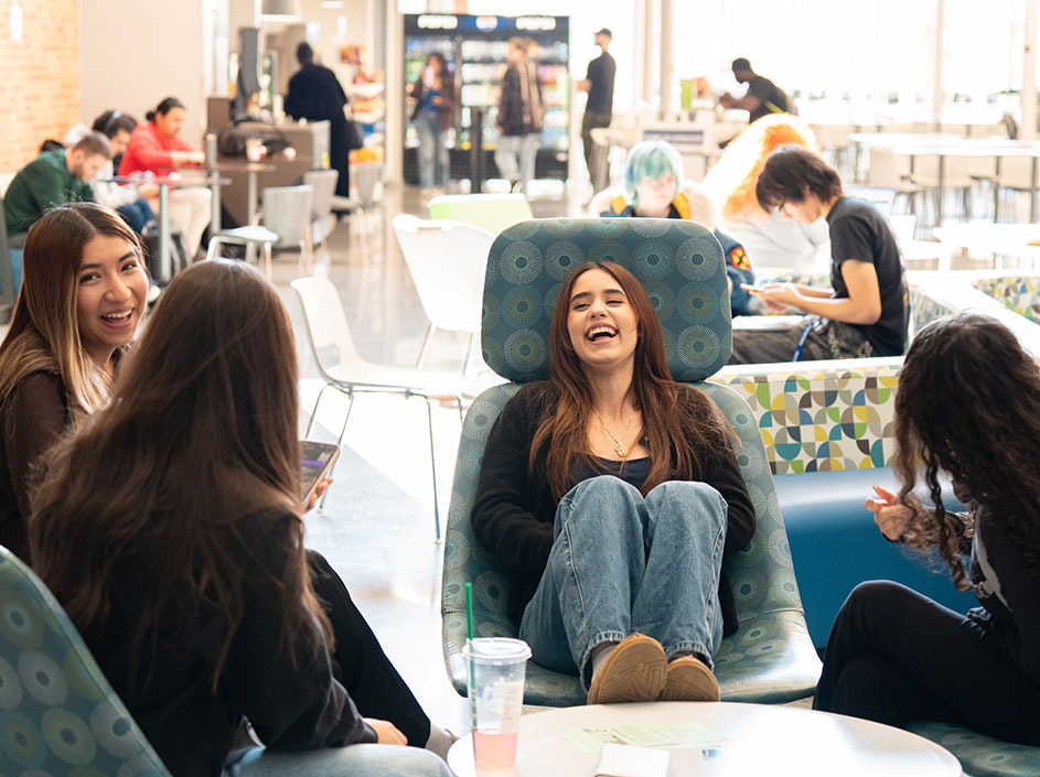Students enjoying a break between classes in the commons