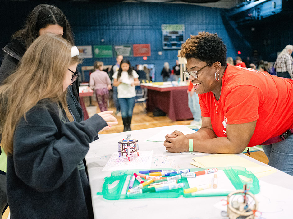 A maker shares her innovation with attendees at Makers Faire Lake County