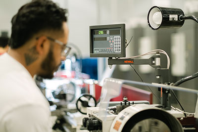 Student monitoring high-tech equipment