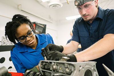 Students working on an engine