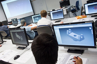 CAD-drafting class showing students working on 3D models