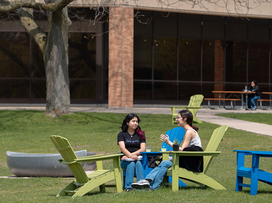 Two students talking outdoors at CLC's Grayslake Campus