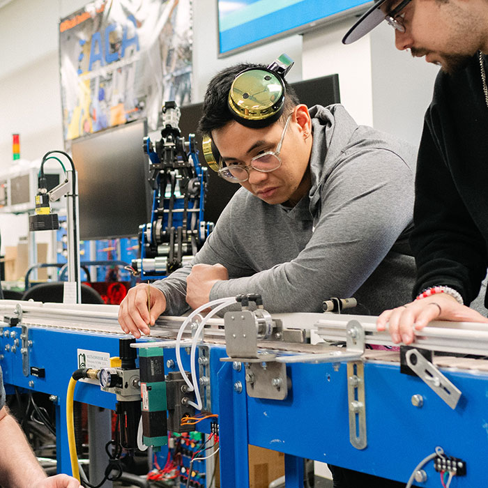 Gabewil Mattheau Chan Sanoria in the ARM lab