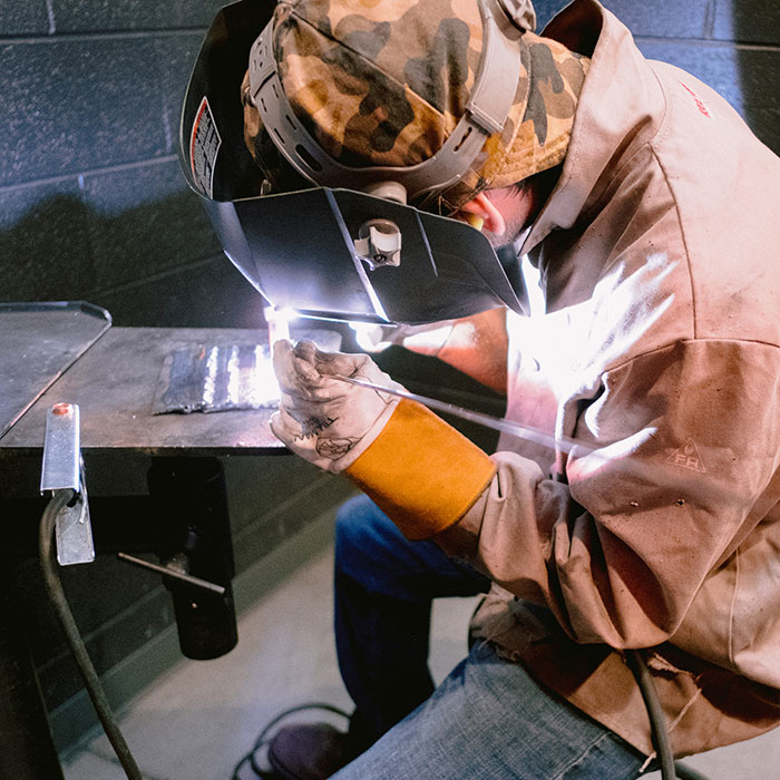 Photo of student in welding and fabrication class