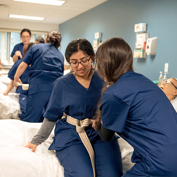CLC medical assisting students practicing skills in the simulation lab
