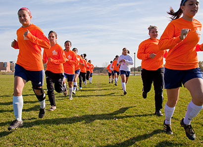 Lancer team running on field