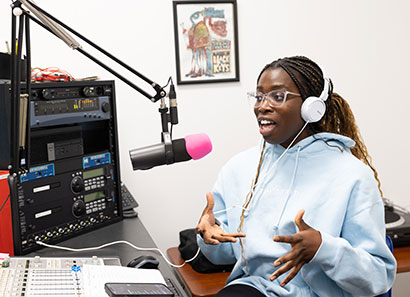 Lancer Radio DJ in broadcast studio